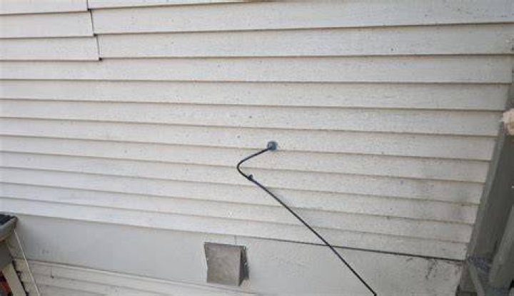Can I run wire behind siding
