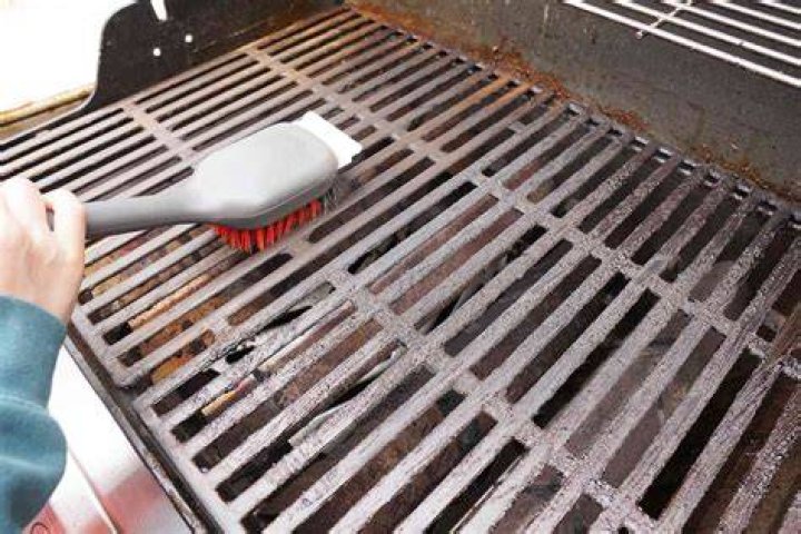 How do I clean a grill brush