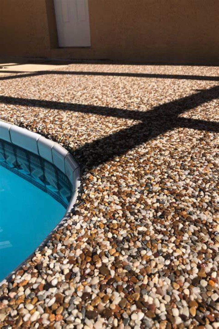 How do you clean a pebble pool deck
