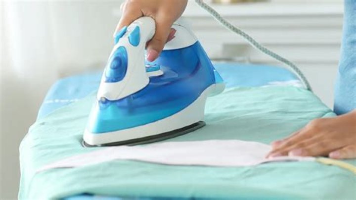 How do you iron a damp cloth