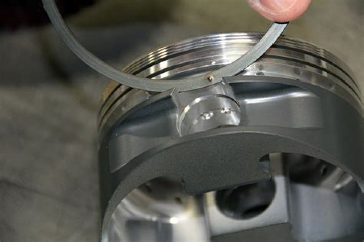 What piston ring goes on top